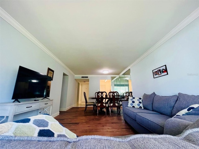 living room featuring ornamental molding and dark wood-type flooring