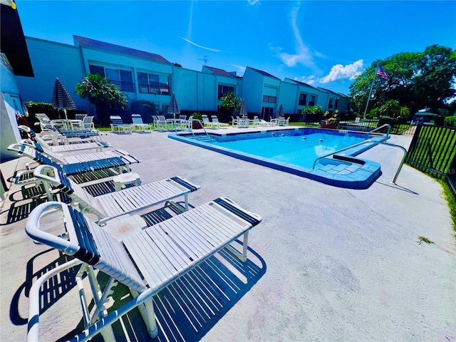 view of swimming pool with a patio area