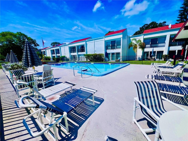 view of swimming pool with a patio area