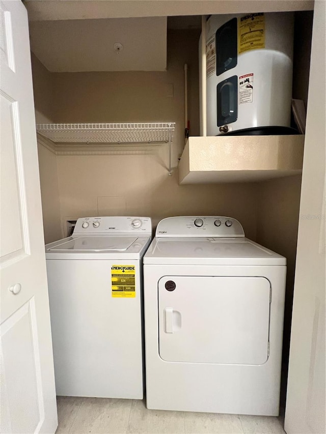 washroom featuring washer and dryer and water heater