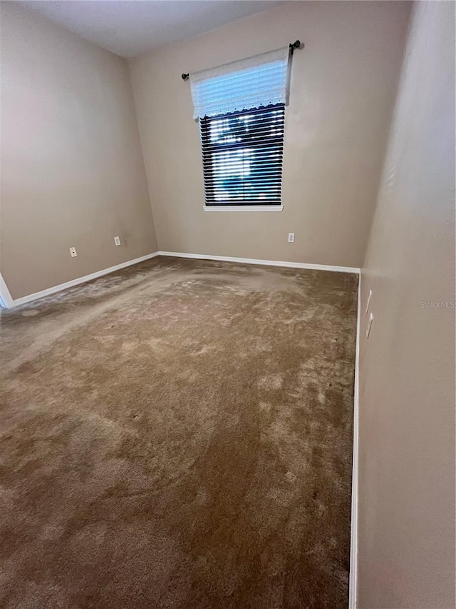 unfurnished room with carpet floors