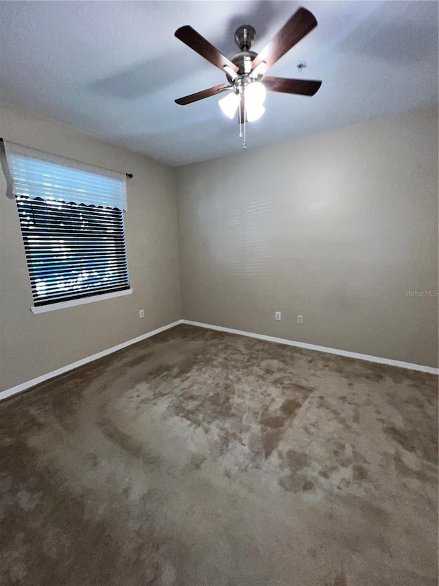 carpeted empty room with ceiling fan