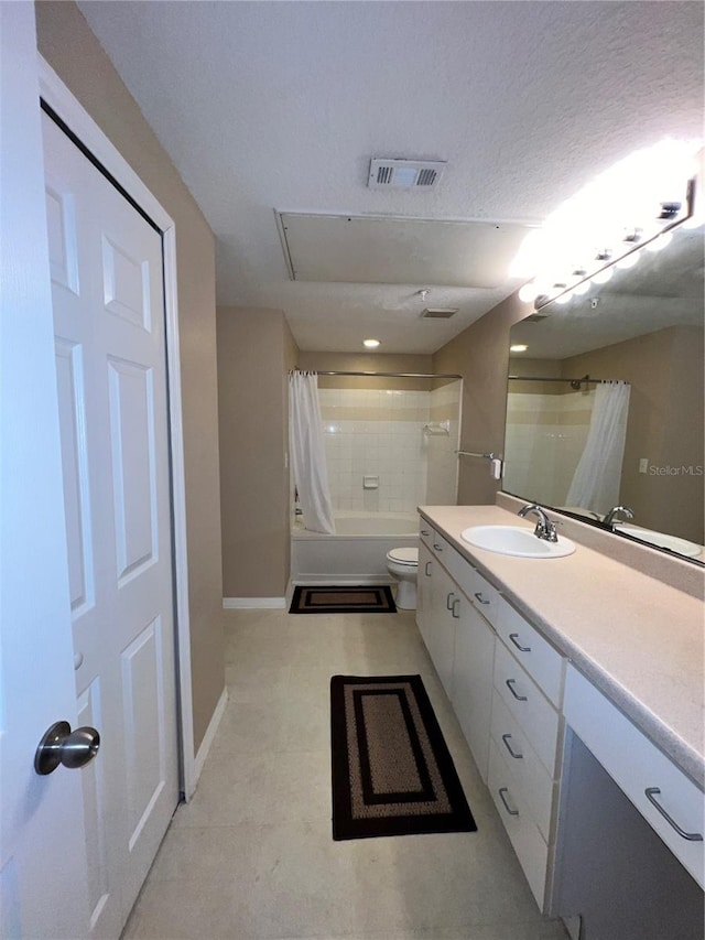 full bathroom featuring shower / tub combo with curtain, vanity, a textured ceiling, and toilet