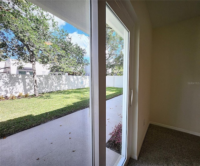 doorway featuring carpet floors