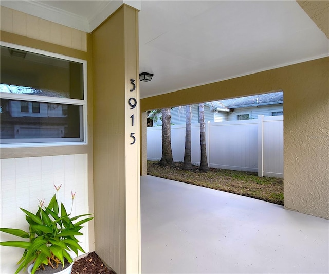 entrance to property with a patio area