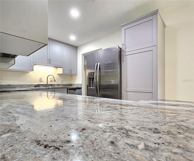 kitchen featuring appliances with stainless steel finishes, gray cabinets, and sink