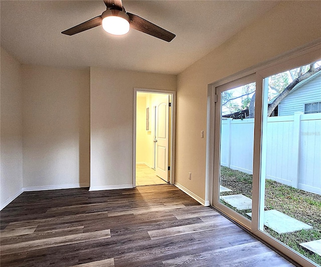 unfurnished room with ceiling fan and hardwood / wood-style floors