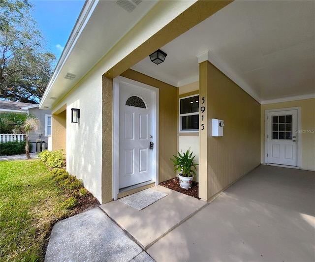 entrance to property with a patio area