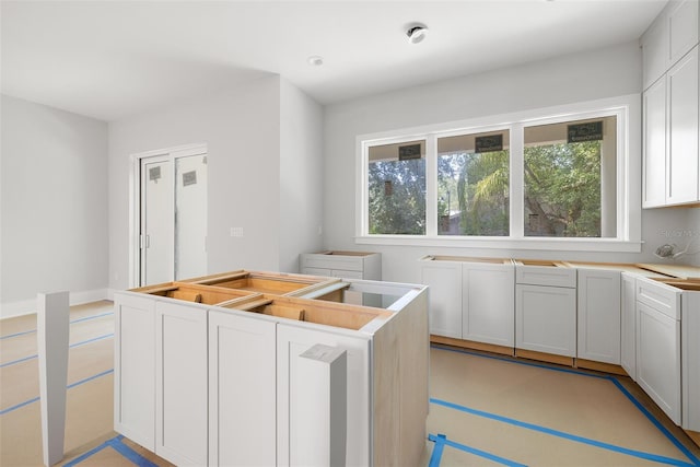 kitchen featuring white cabinets