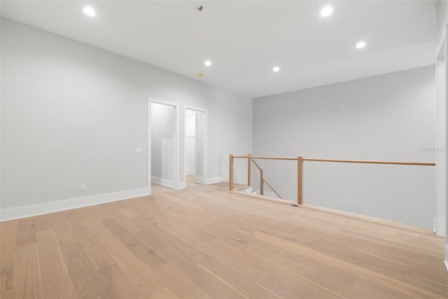 spare room featuring light hardwood / wood-style flooring