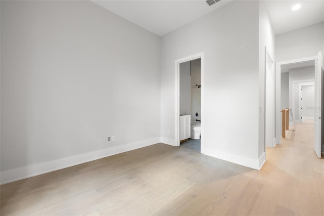 unfurnished room with light hardwood / wood-style flooring