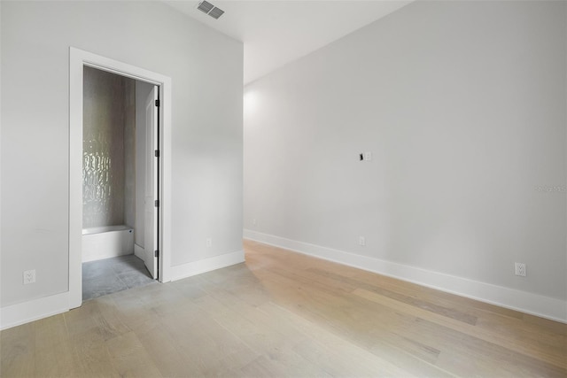 unfurnished room with light hardwood / wood-style flooring