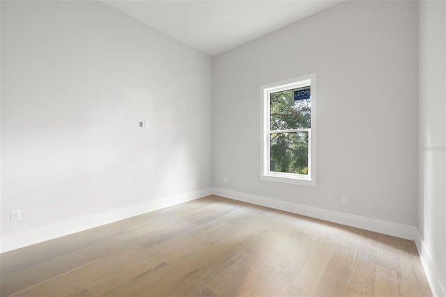 spare room featuring light wood-type flooring