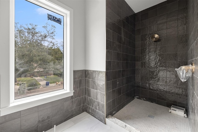 bathroom with a tile shower