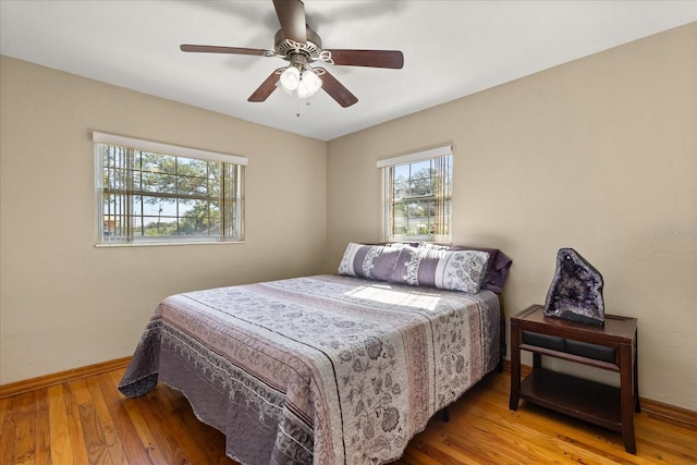 bedroom featuring ceiling fan and hardwood / wood-style floors