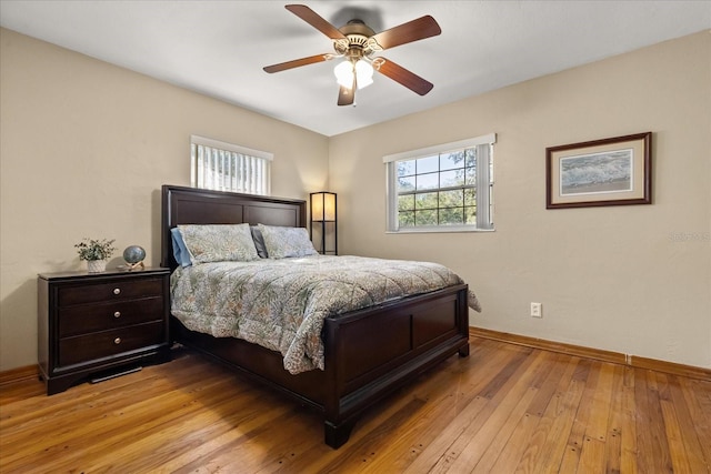 bedroom featuring ceiling fan and light hardwood / wood-style flooring