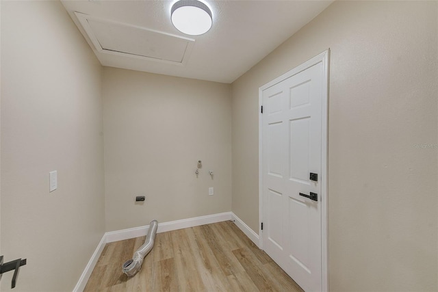 laundry room with light wood-type flooring