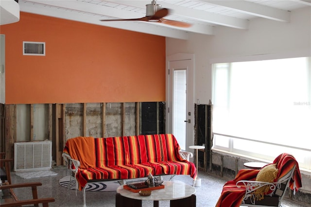 living room featuring beam ceiling and ceiling fan