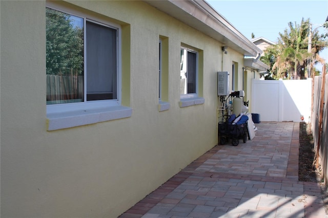 view of side of property featuring a patio area