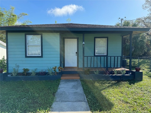 view of front facade with a porch and a front yard