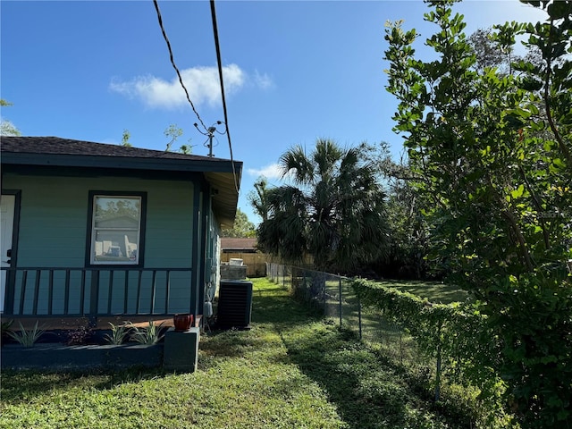 view of yard featuring central air condition unit