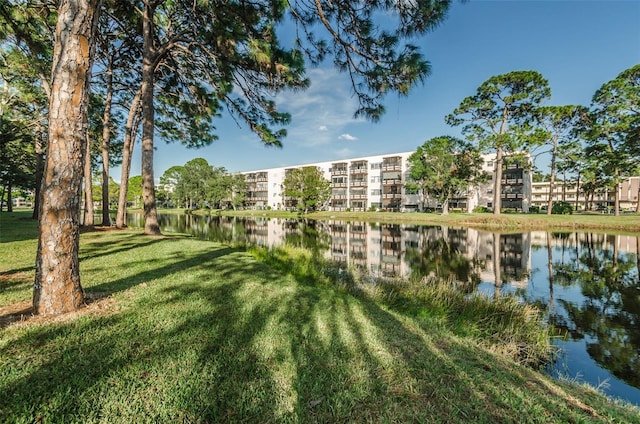 exterior space featuring a yard and a water view