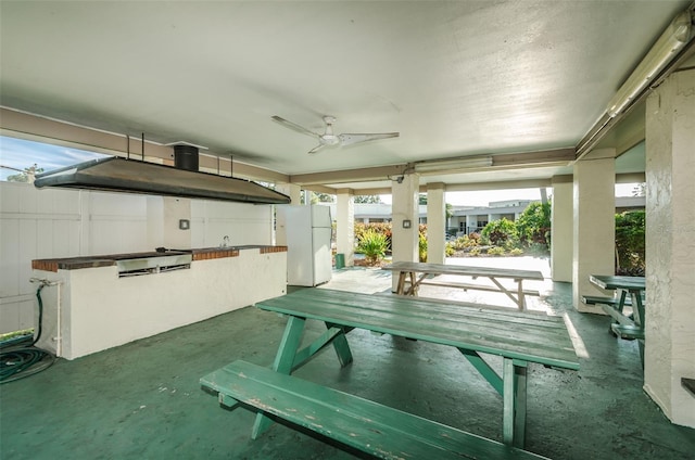 interior space with ceiling fan