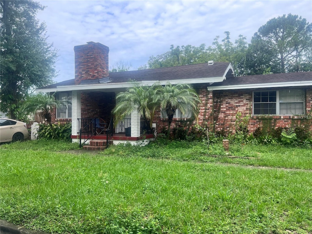 exterior space with a yard