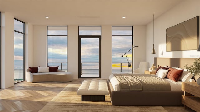 bedroom featuring access to outside, multiple windows, light parquet flooring, and a water view