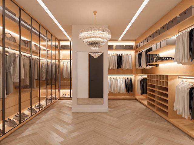 spacious closet featuring an inviting chandelier and light parquet floors