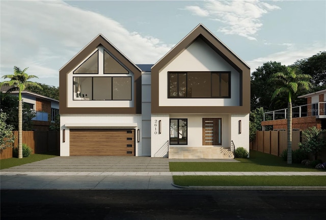 contemporary house with stucco siding, a garage, and fence