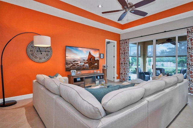 living room featuring ceiling fan and light tile patterned floors