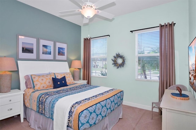 bedroom with ceiling fan and light carpet