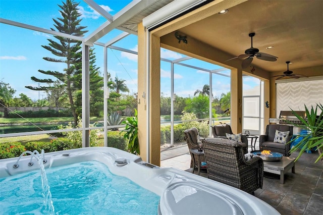 sunroom featuring plenty of natural light and a jacuzzi