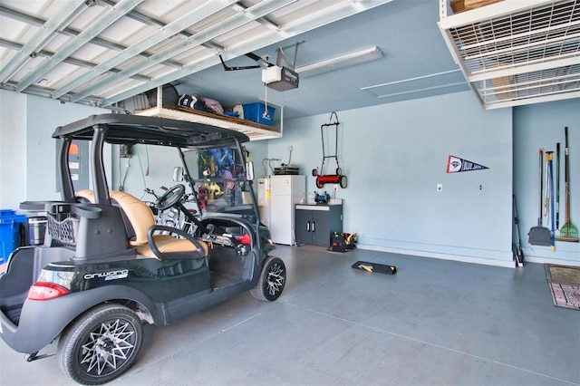 garage with a garage door opener and refrigerator