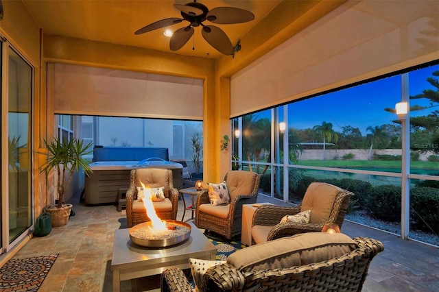 sunroom / solarium with ceiling fan