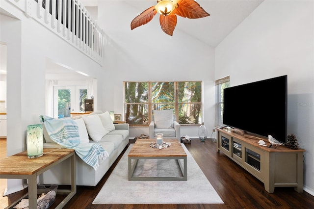 living room with french doors, dark hardwood / wood-style flooring, high vaulted ceiling, and ceiling fan