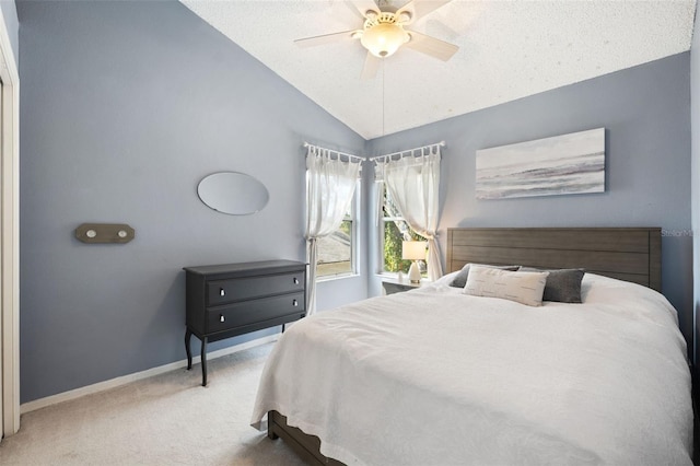 bedroom with carpet, ceiling fan, and lofted ceiling