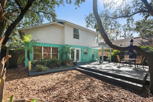 back of house featuring a deck