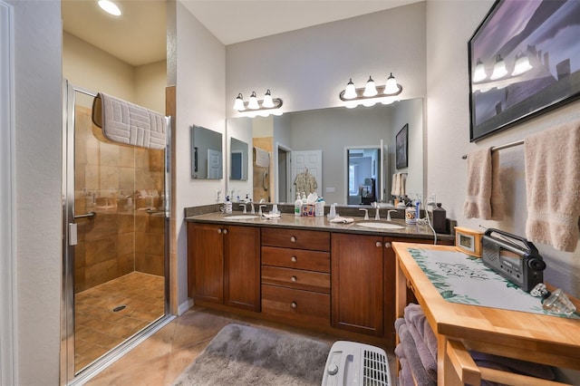 bathroom featuring tile patterned flooring, vanity, and an enclosed shower