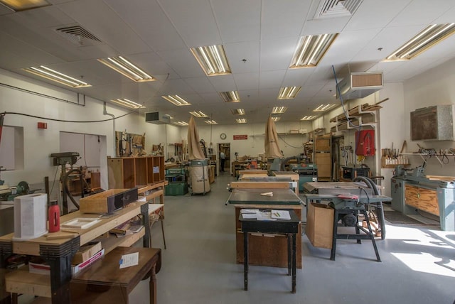 interior space with a workshop area and concrete floors