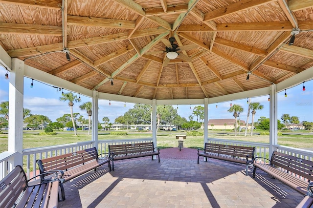 surrounding community with a gazebo and a patio area