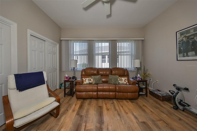 living room with hardwood / wood-style flooring, ceiling fan, and a wealth of natural light