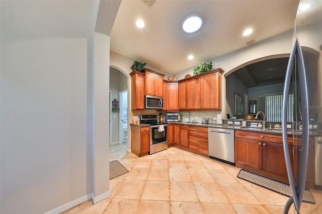 kitchen with sink and appliances with stainless steel finishes