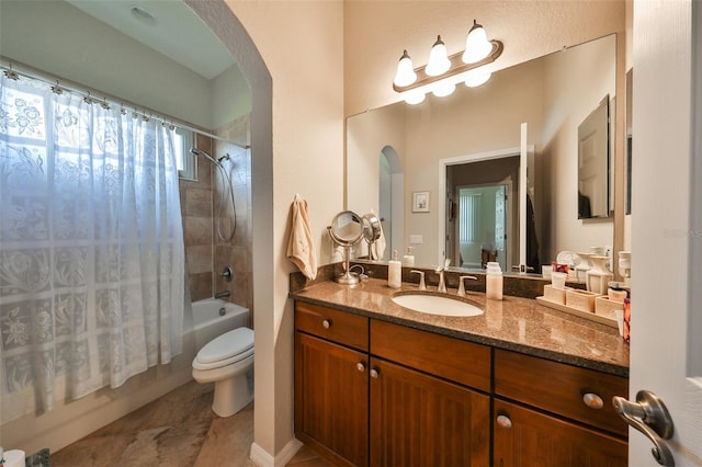 full bathroom with vanity, toilet, and shower / tub combo