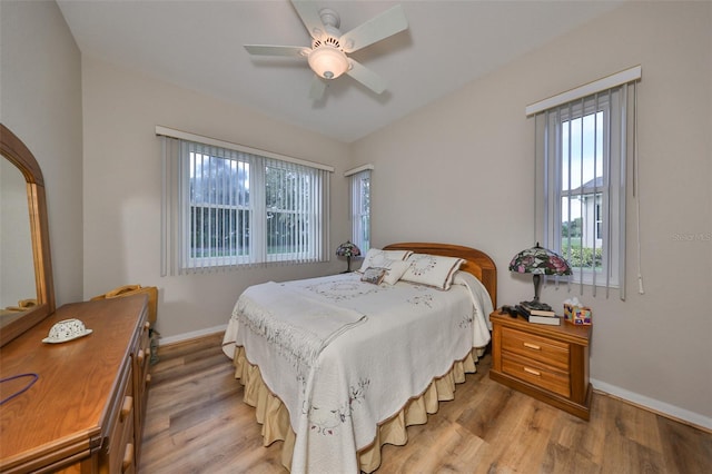 bedroom featuring light hardwood / wood-style floors and ceiling fan