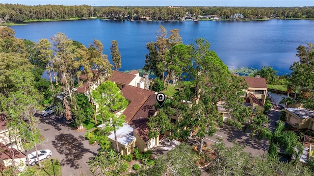 birds eye view of property with a water view