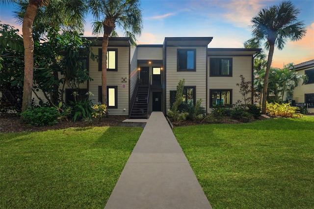 view of front of home with a lawn