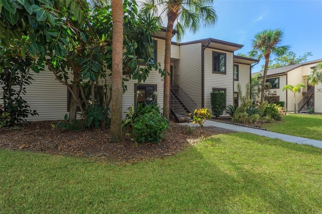 view of front of home with a front lawn