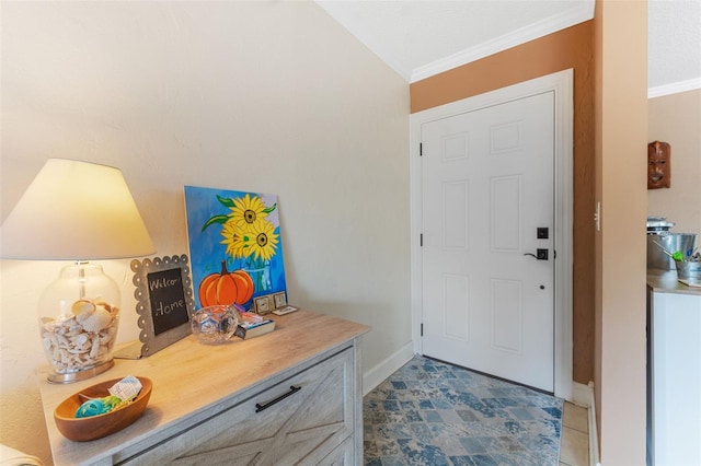 foyer entrance featuring vaulted ceiling and crown molding